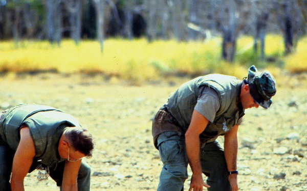 Anti-tank and anti-personnel land mines are stacked for destruction.