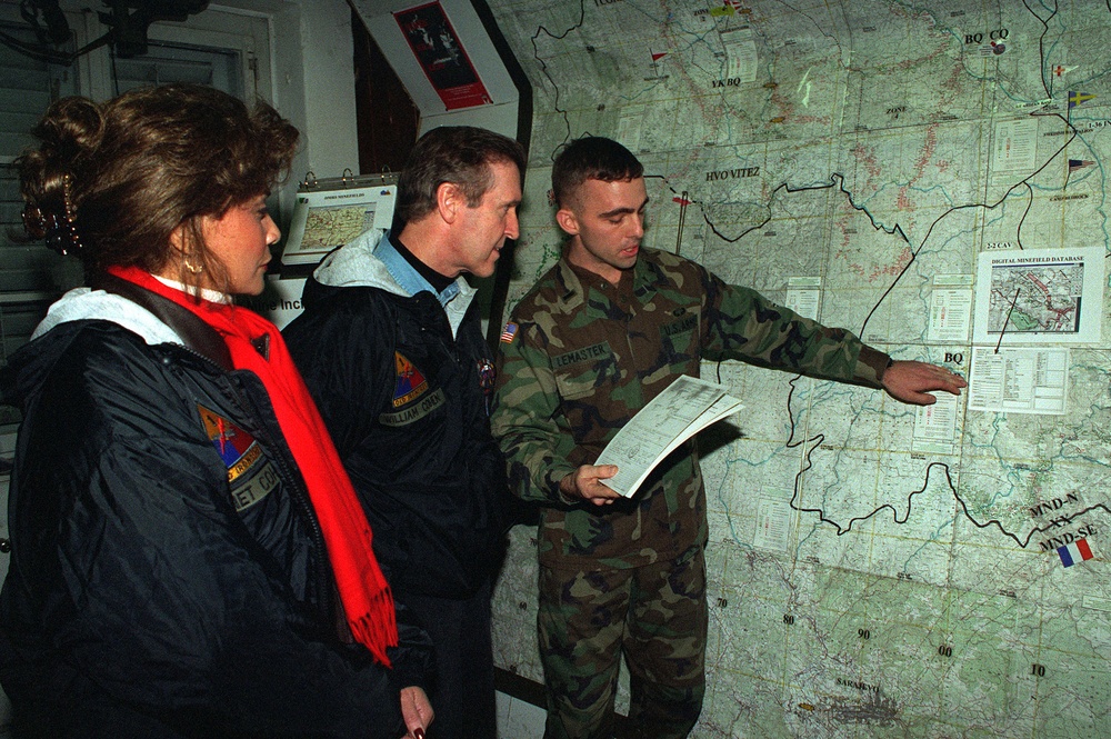 Secretary and Mrs. Cohen are briefed on the removal of land mines in Bosnia and Herzegovina.