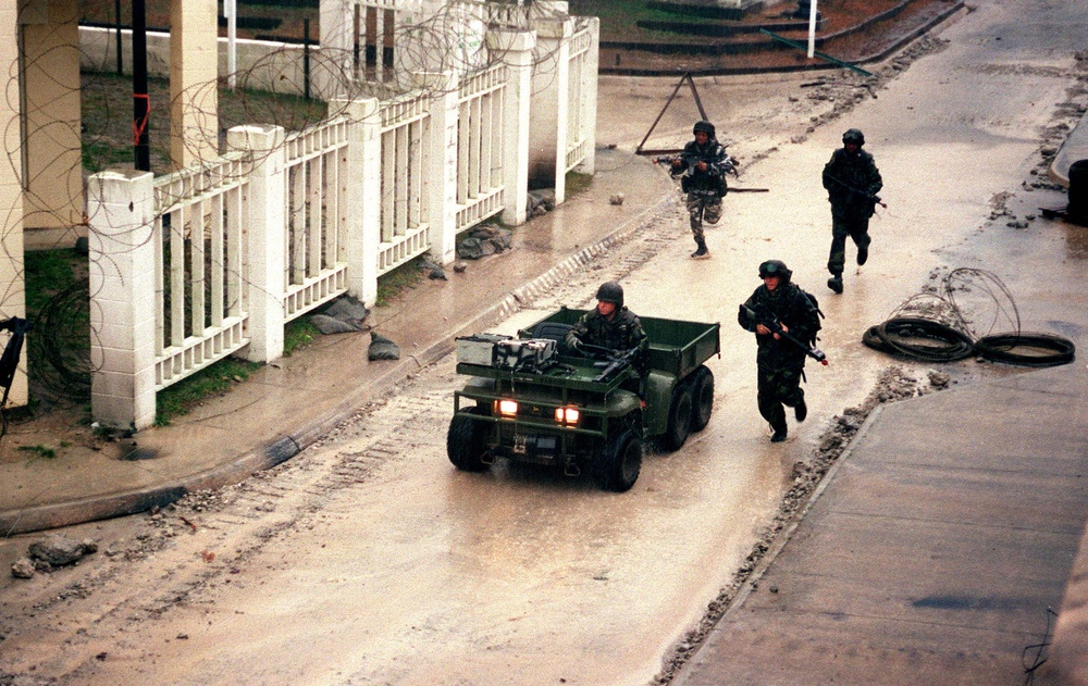 U.S. Marines maneuver through the Military Operations in Urban Terrain facility.