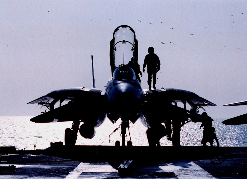 A Fighter Squadron 102 pilot gives his F-14B Tomcat a pre-flight inspection.