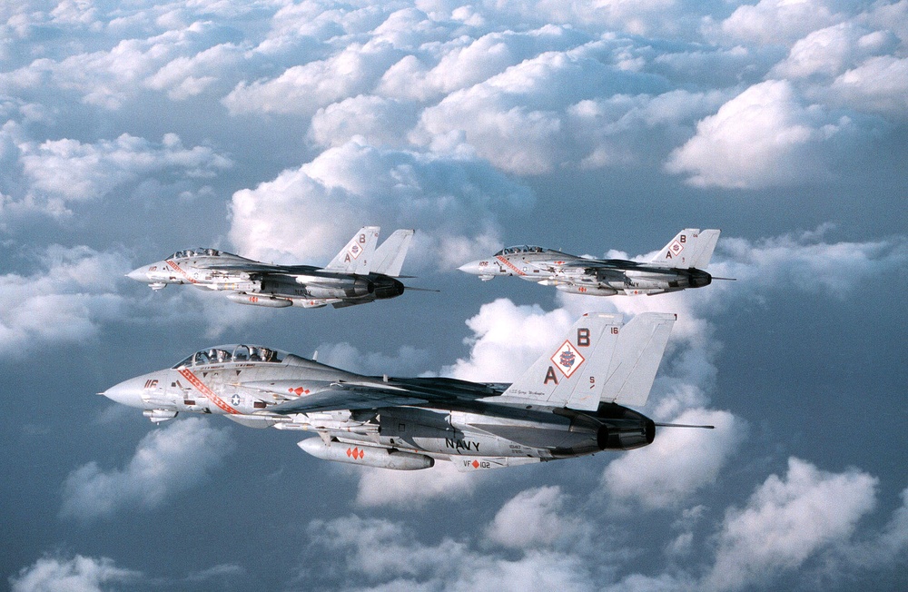 Three U.S. Navy F-14B Tomcats patrol the sky over the Persian Gulf.