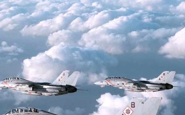 Three U.S. Navy F-14B Tomcats patrol the sky over the Persian Gulf.