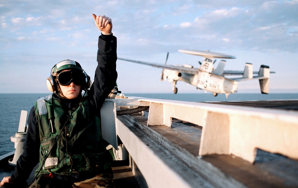Airman Brian Nestby gives the thumbs up after a successful E-2C Hawkeye launch.