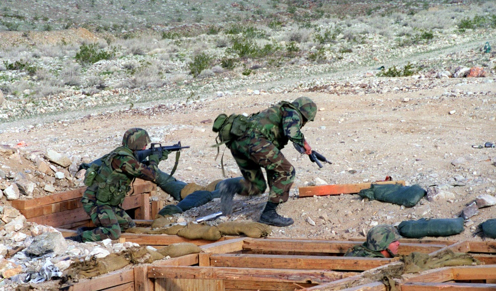 Marines from Bravo Company, 1st Battalion, 6th Marine Regiment, rush toward the target.