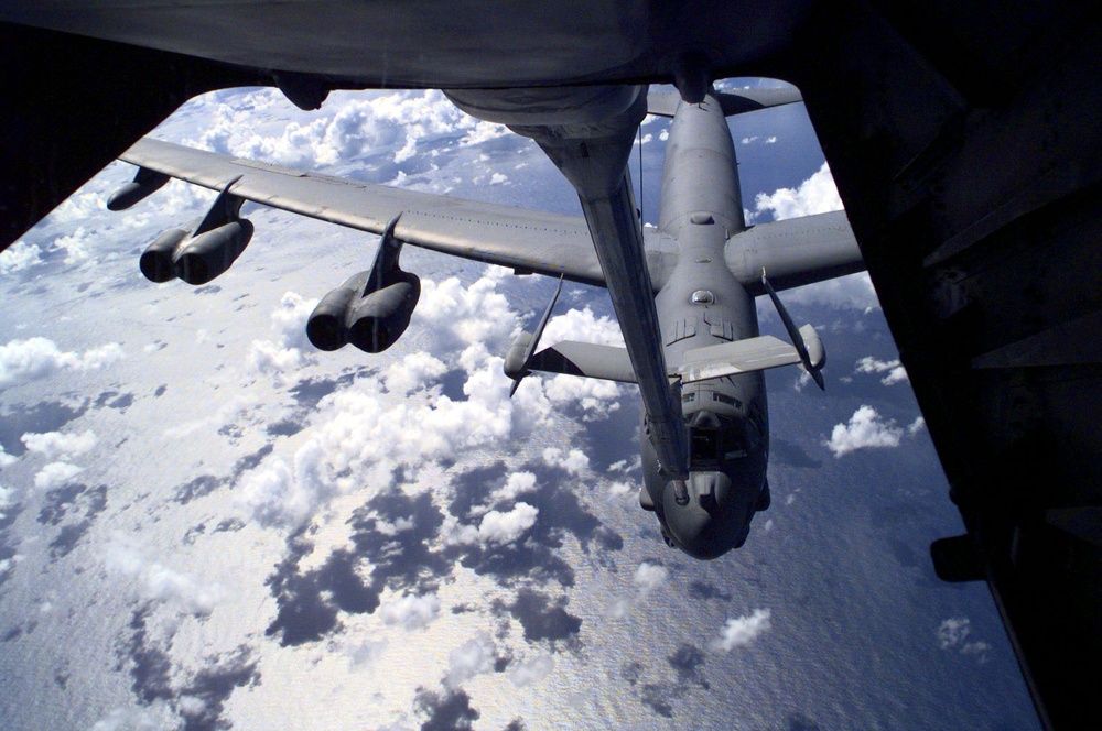 A B-52H Stratofortress approaches the refueling boom of a KC-10 Extender.
