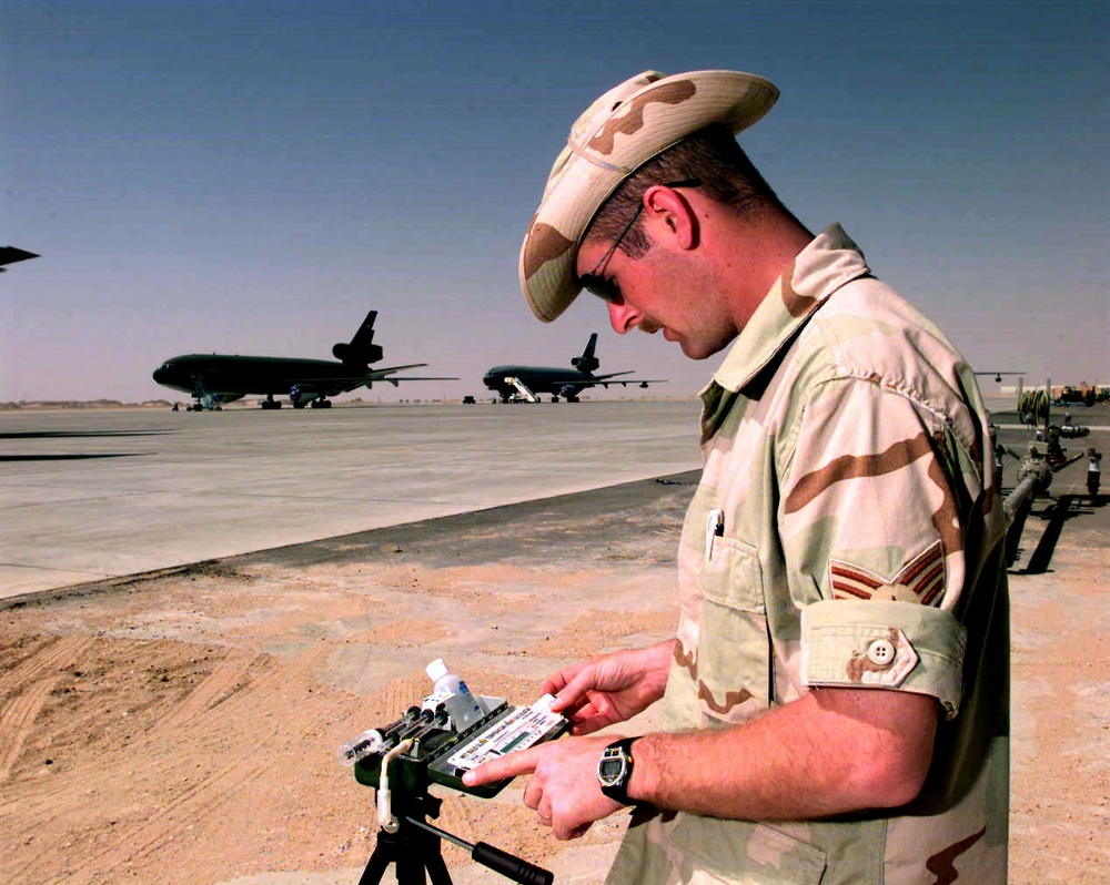 Senior Airman Petro checks a heat index meter alongside the KC-10 Extender ramp area.