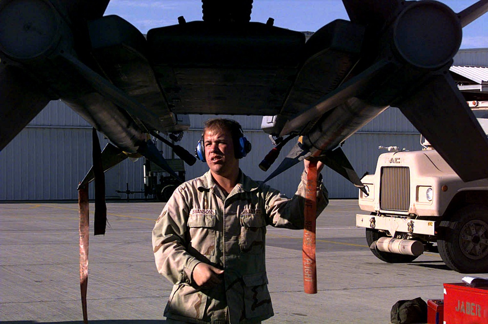 Airman 1st Class Brian Swanson secures two AIM-9 air-to-air missiles on an A-10 Thunderbolt.
