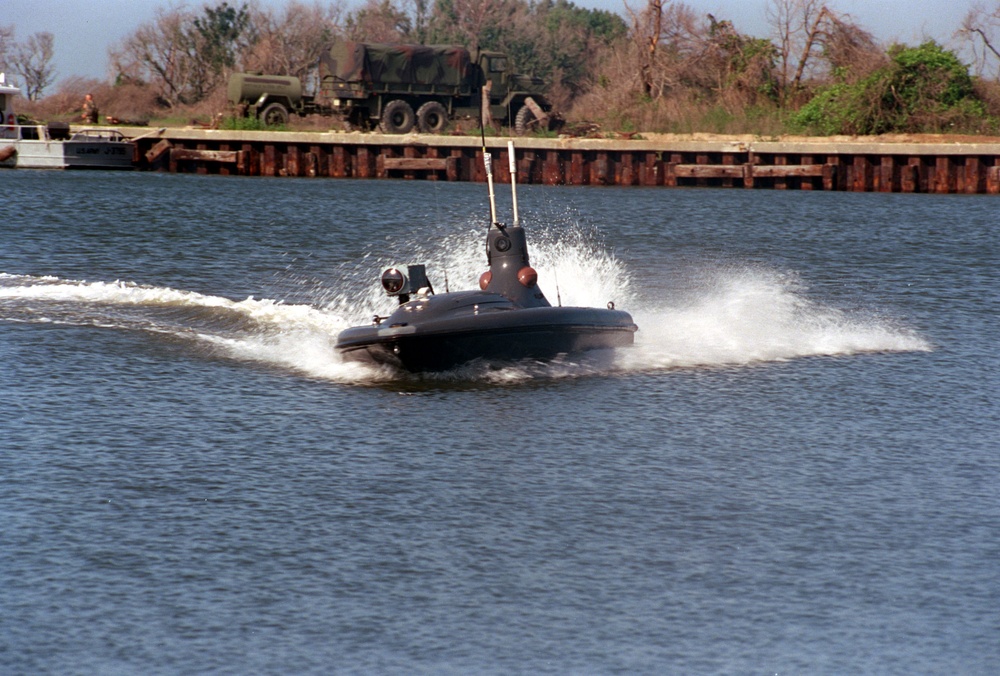 An Owl MK II Unmanned Surface Vehicle cuts through the waters of Mile Hammock Bay.
