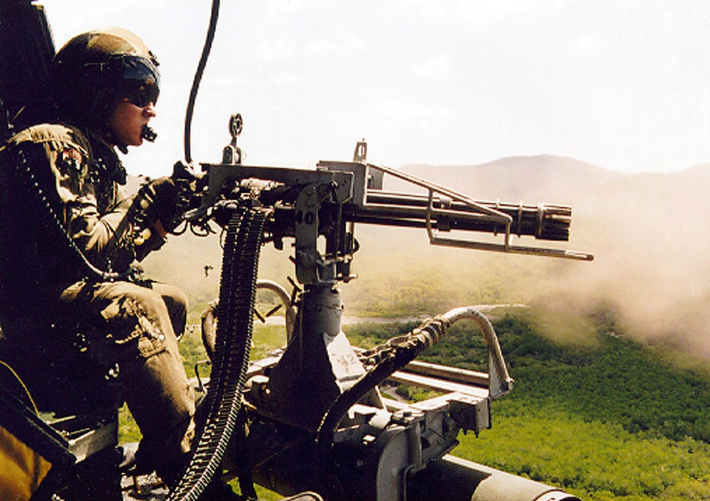 Cpl. Michael R. Parker fires a GAU-17 mini-gun to provide close air support at Shoalwater Bay.