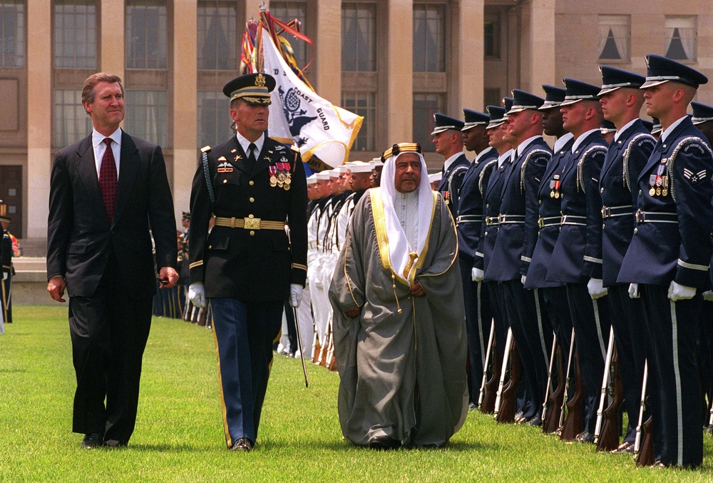 Secretary Cohen escorts His Highness Shaikh Essa bin Salman Al-Khalifa as he inspects the troops.
