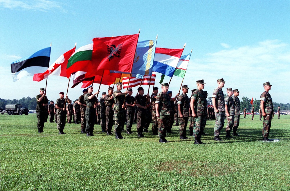 Flag bearers stand on the parade field at Camp Lejeune for the opening of Cooperative Osprey '98.