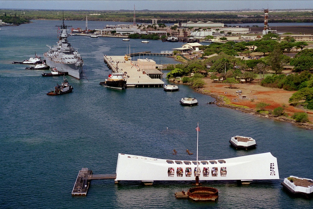 The battleship USS Missouri (BB 63) joins the USS Arizona Memorial in Pearl Harbor.