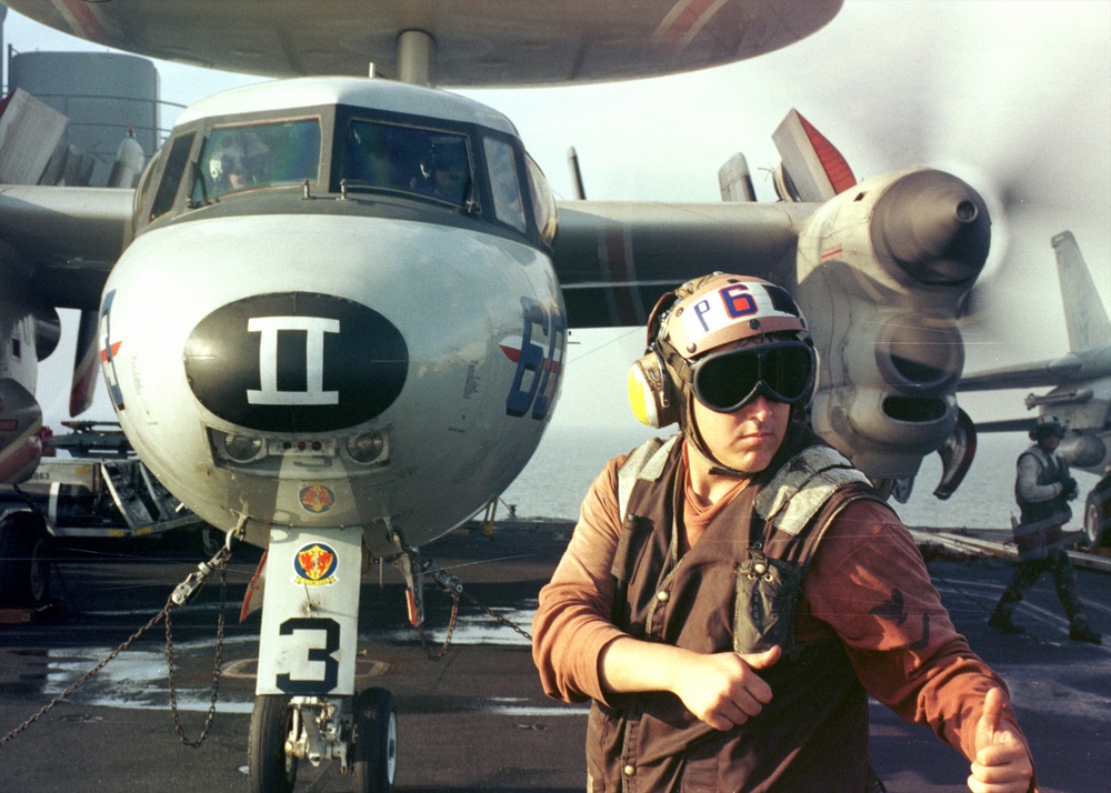 An E-2C Hawkeye responds to the order &quot;turn engines.&quot;