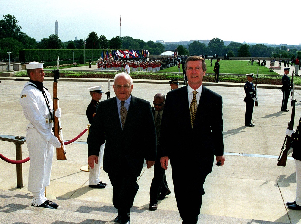 Secretary Cohen escorts Minister of Defense Jose Veiga Simao into the Pentagon.