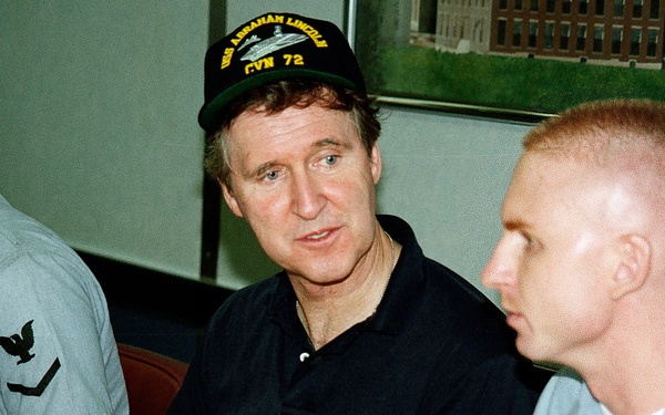 Secretary Cohen speaks with Petty Officer Rinehart on the USS Abraham Lincoln.