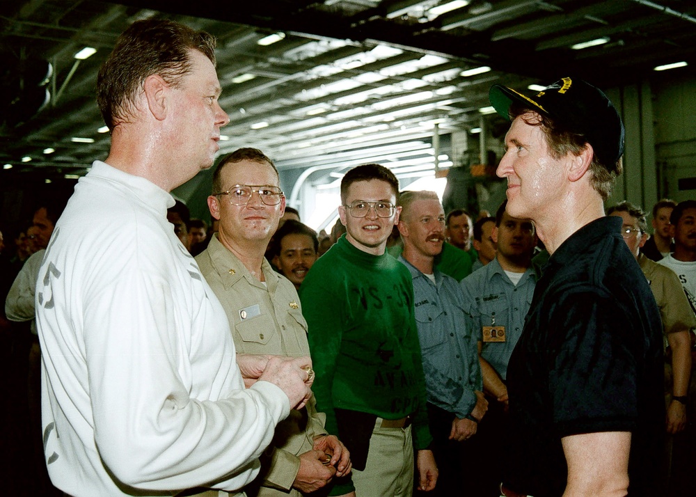 Secretary Cohen meets with some of the crew in the hangar deck of the USS Abraham Lincoln.