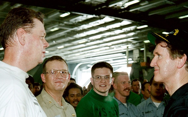 Secretary Cohen meets with some of the crew in the hangar deck of the USS Abraham Lincoln.