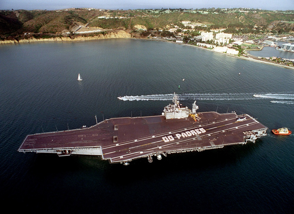 Crew members of the aircraft carrier USS Constellation (CV 64) spell out &quot;Go Padres.&quot;