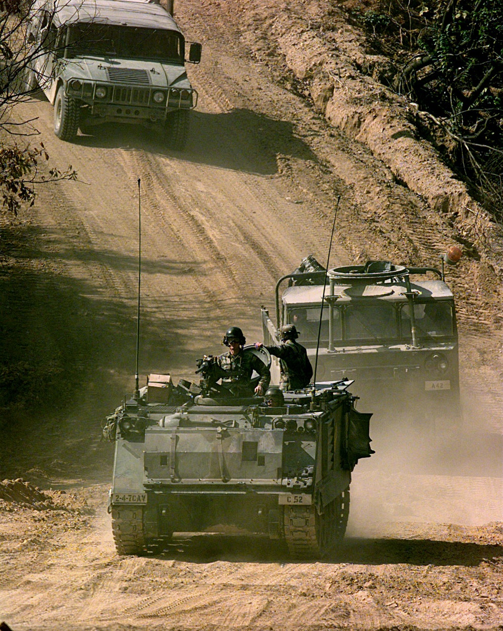Soldiers assigned to C Troop drive an M-113A1 Armored Personnel Carrier to the live fire range.