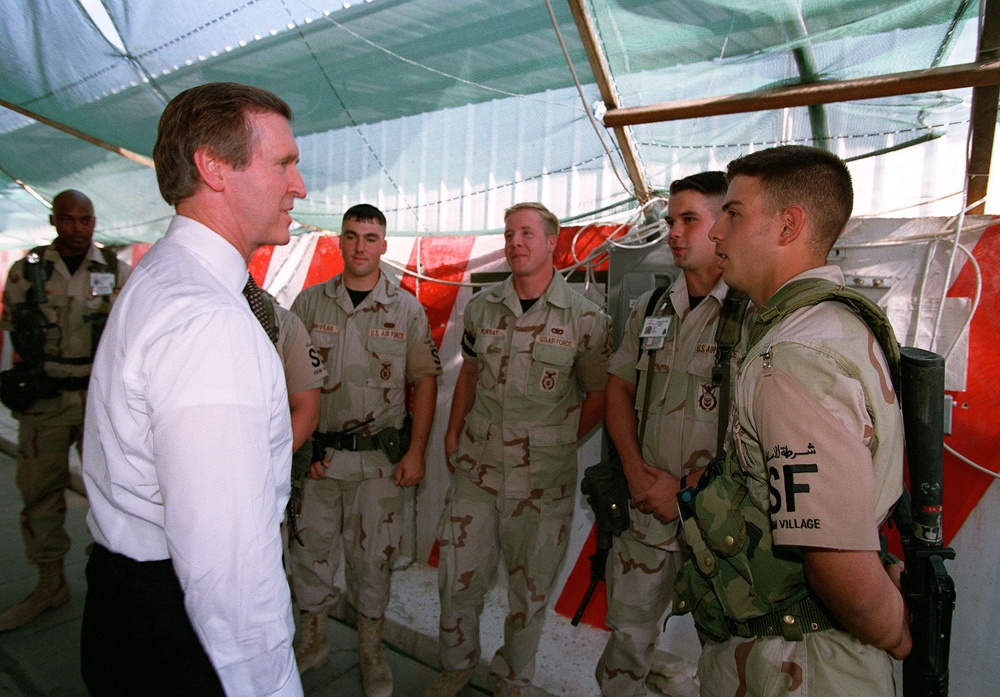 Secretary Cohen pauses to speak with the security forces at Eskan Village, Saudi Arabia.