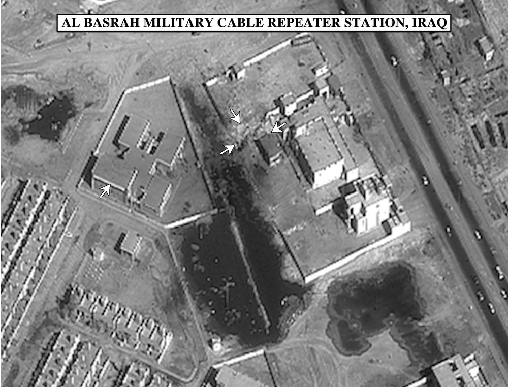 Bomb damage assessment photo of the Al Basrah Military Cable Repeater Station, Iraq.