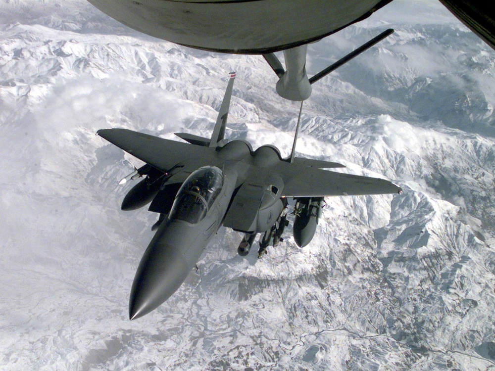 An F-15E Strike Eagle approaches a tanker during a routine patrol over Northern Iraq.
