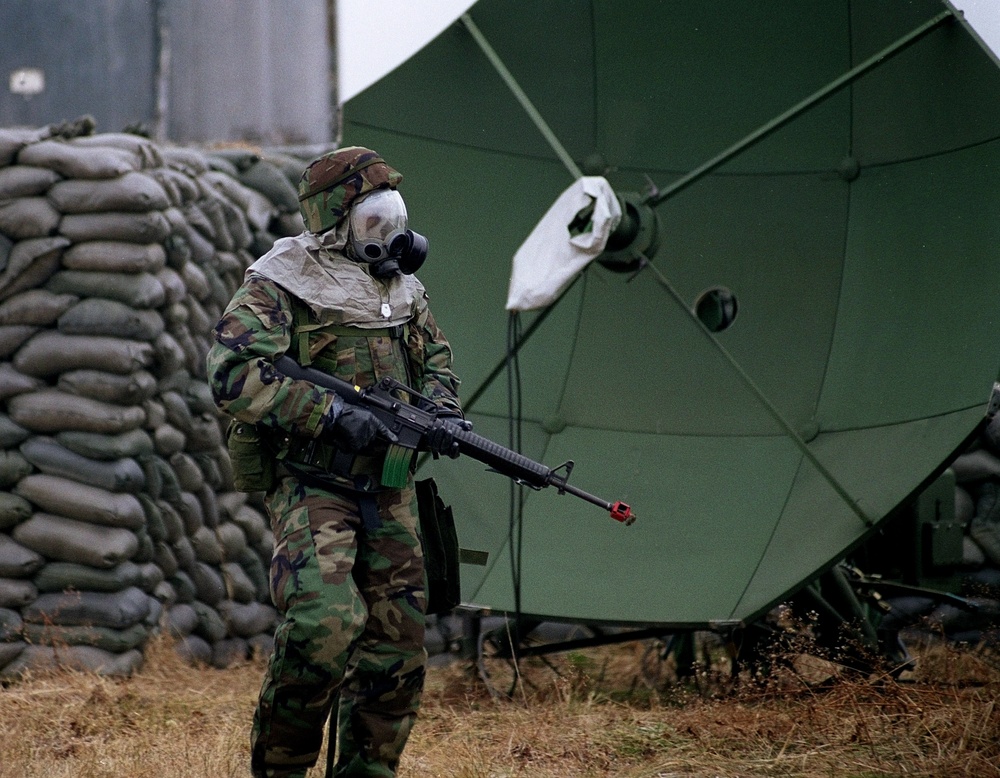 A member of the 51st Security Forces Squadron conducts a search at Osan Air Base.