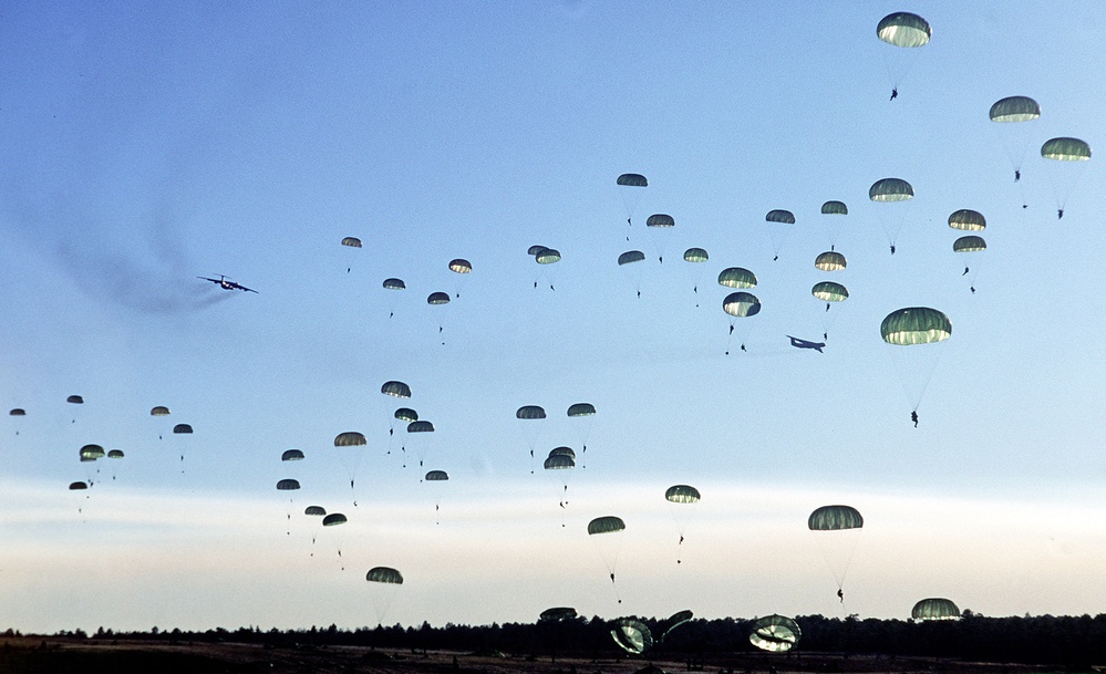 Soldiers of the 82nd Airborne float to the ground at Normandy drop zone on Fort Bragg, N.C.