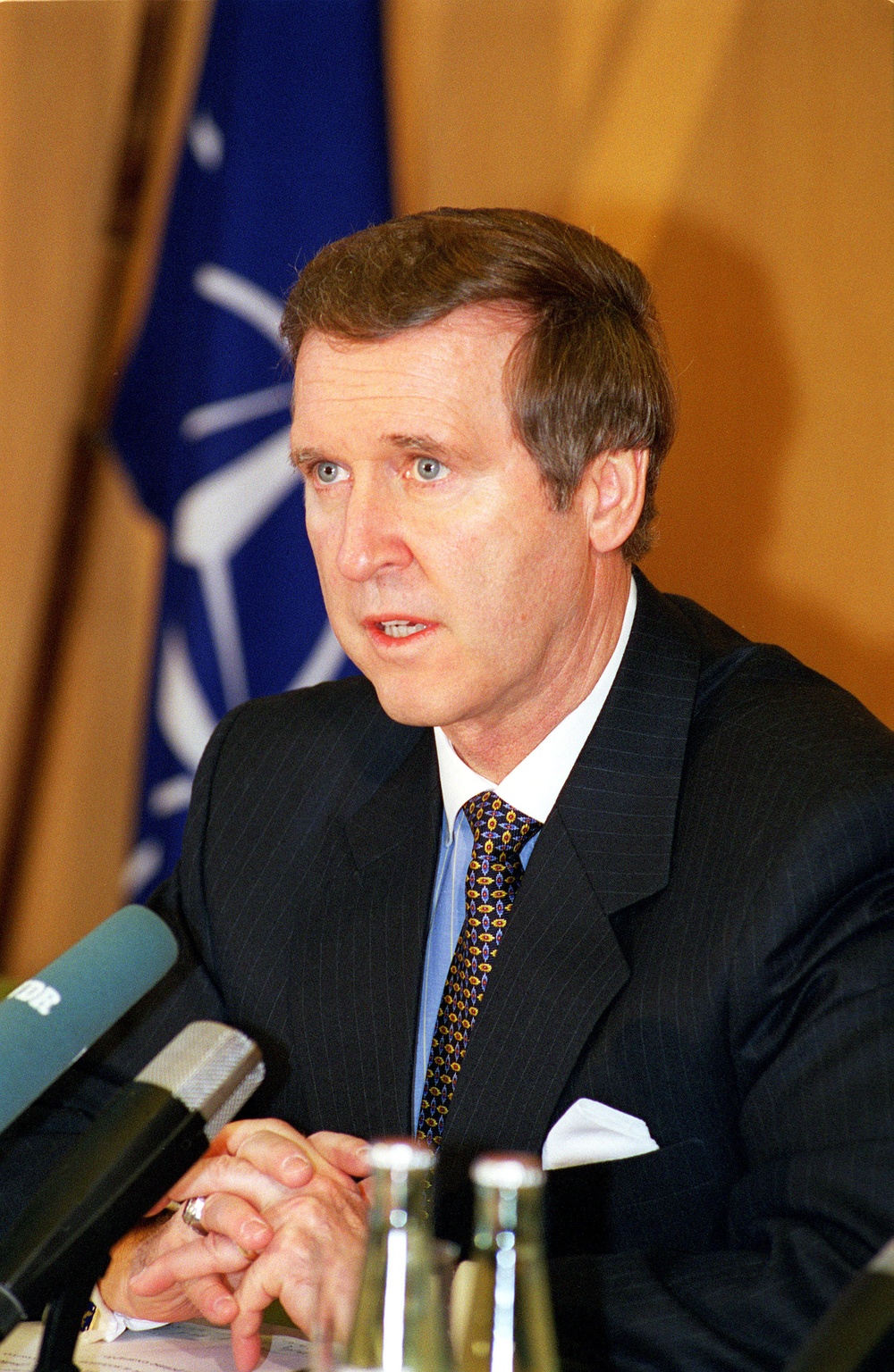 Secretary Cohen responds to a question during a press conference in Bonn, Germany.