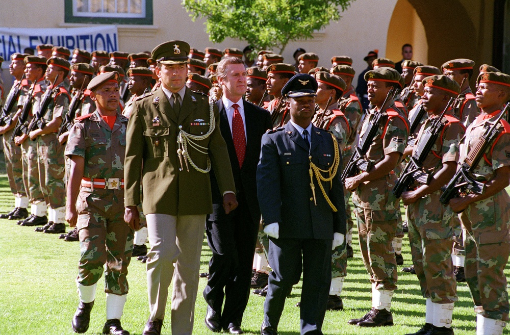 Military officers escort Secretary Cohen in Cape Town, Republic of South Africa.
