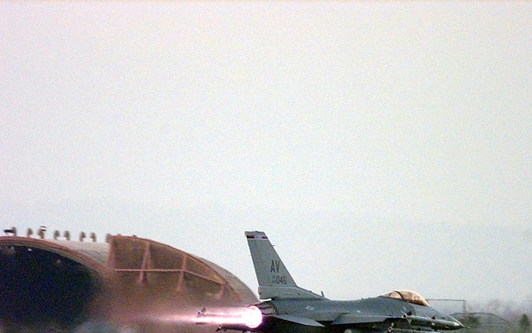 The after burner blazes as a Fighting Falcon takes off from Aviano Air Base during Allied Force.