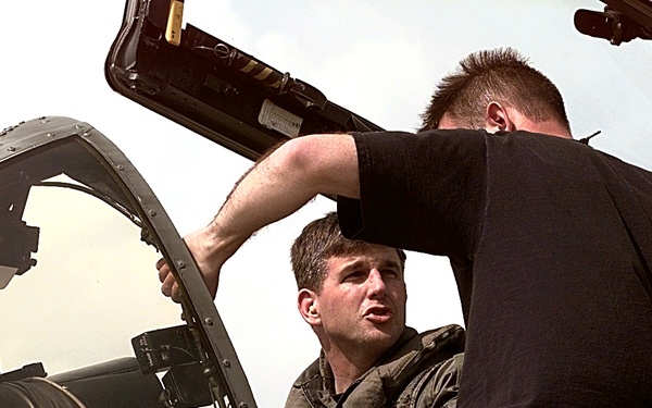 An A-10 Thunderbolt II pilot discusses the airplane's performance with his crew chief at Aviano.