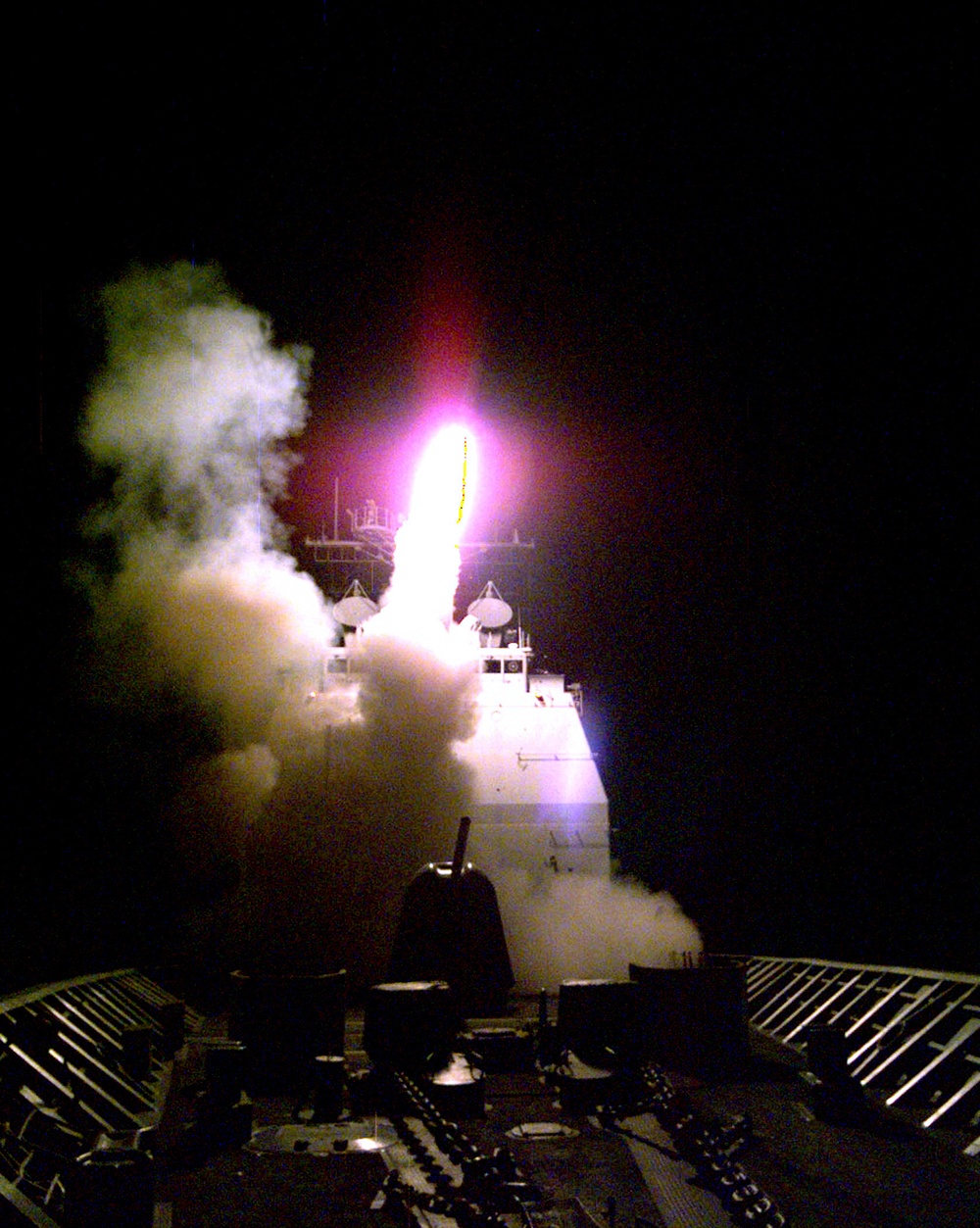 A Tomahawk cruise missile launches from the forward missile deck of the USS Philippine Sea.
