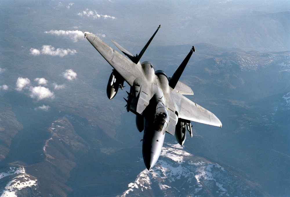 An F-15C Eagle breaks away from a KC-135R Stratotanker after in-flight refueling.