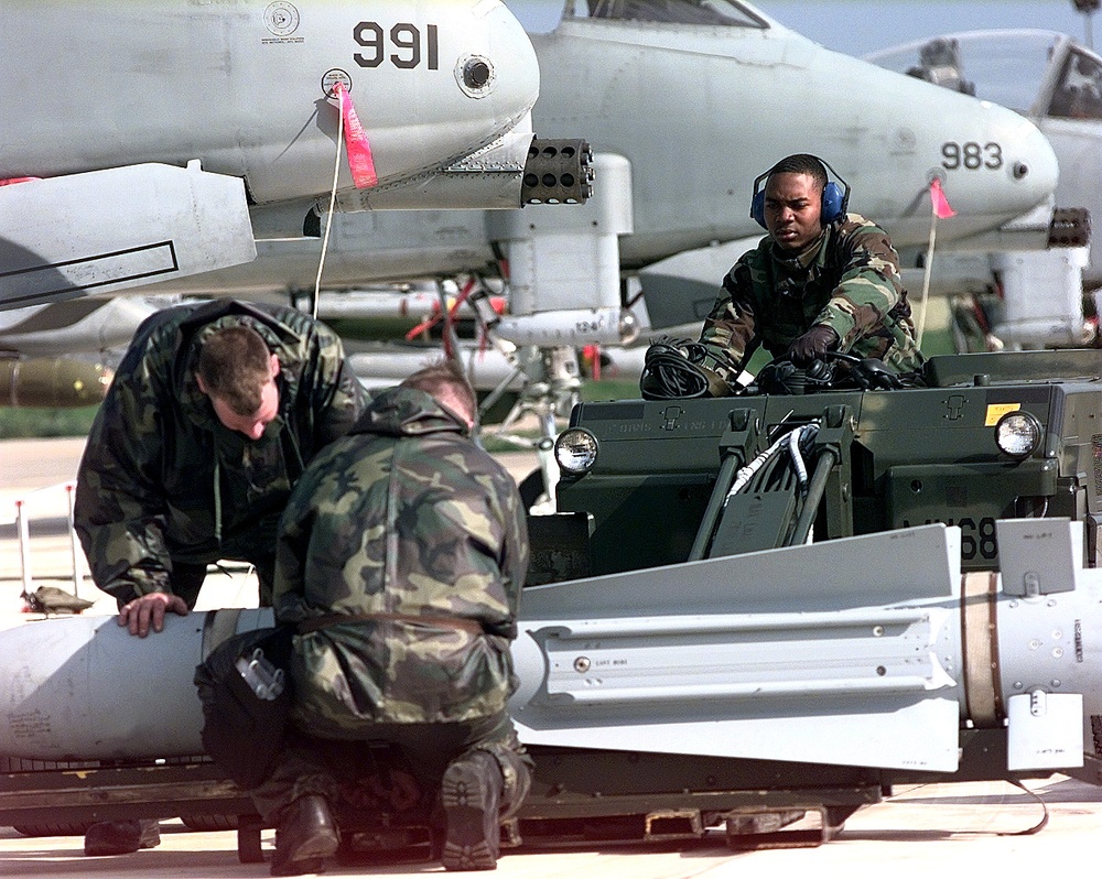 Airman McKinte Young positions the bomb load truck at Gioia del Colle.