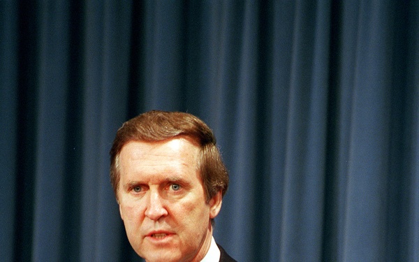 Secretary Cohen responds to a reporter's question during a joint press briefing.