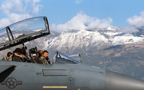 Senior Airman Christopher, Sgt. Bugle and Staff Sgt. Manneque perform checks on an F-15E Strike Eagle