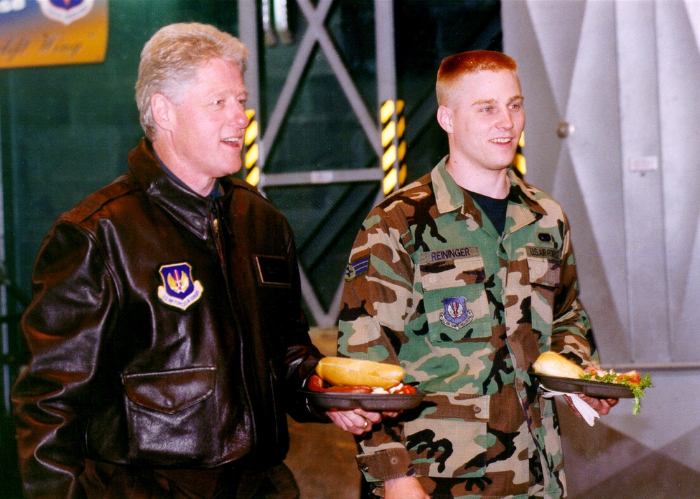 President Clinton and Senior Airman Reininger walk to their table at Ramstein Air Base.