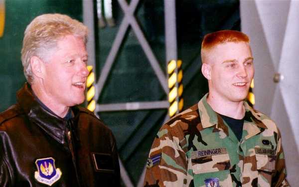 President Clinton and Senior Airman Reininger walk to their table at Ramstein Air Base.