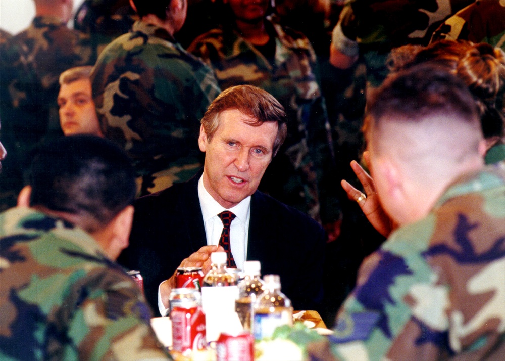 Secretary of Defense Cohen visits with troops during a dinner at Ramstein Air Base.