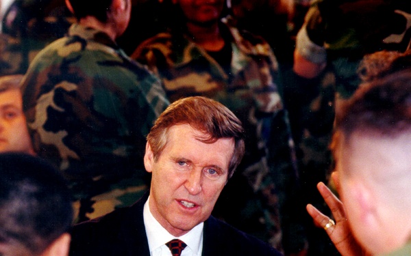 Secretary of Defense Cohen visits with troops during a dinner at Ramstein Air Base.
