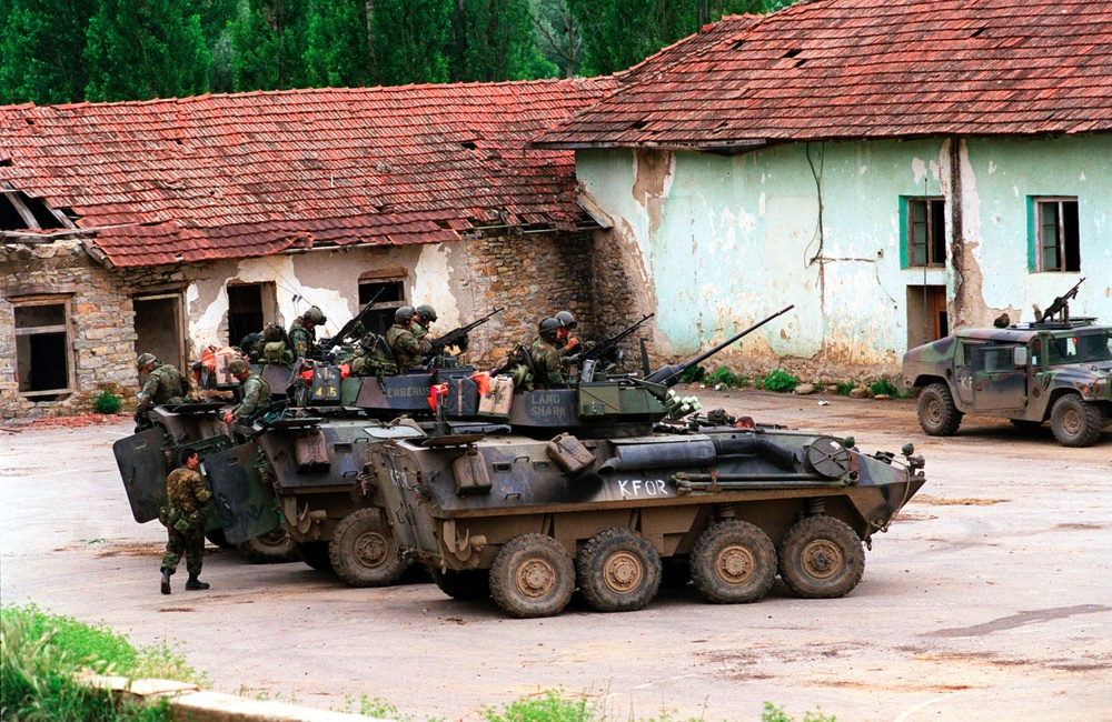 Marines from the 2nd Light Armored Reconnaissance Battalion prepare for an urban patrol in Zegra, Kosovo.