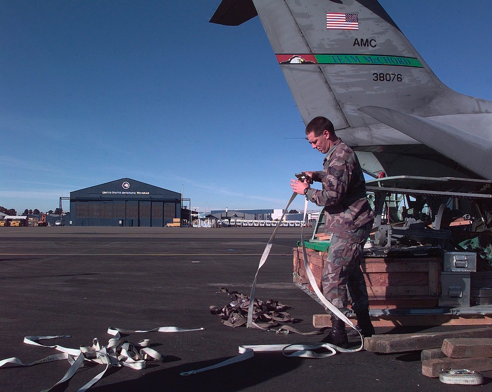 Staff Sgt. Barry Buchmiller readies for a humanitarian mid-winter air drop mission.