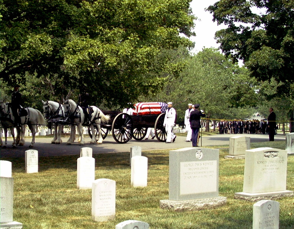 The coffin containing the remains of Astronaut Charles &quot;Pete&quot; Conrad Jr. is carried by a caisson at Arlington.