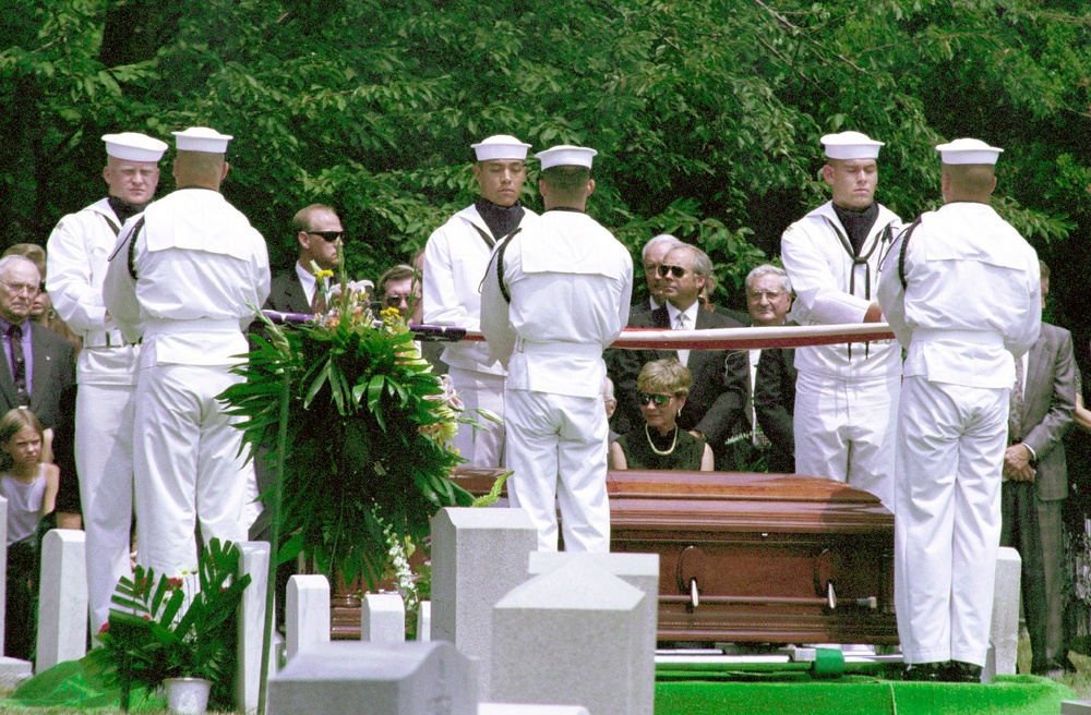 The Ceremonial Guard folds the flag that covered the coffin of Astronaut Charles &quot;Pete&quot; Conrad Jr.
