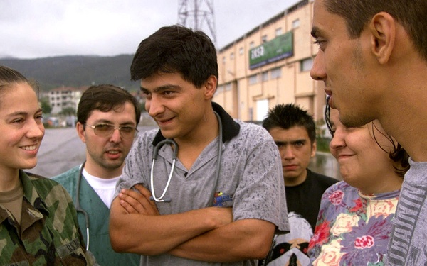 Petty Officer 3rd Class Rebecca Vanderburg talks with earthquake survivors in Izmit, Turkey.