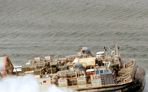 A U.S. Navy Landing Craft Air Cushion carries vehicles and supplies for use ashore at Hersek, Turkey.