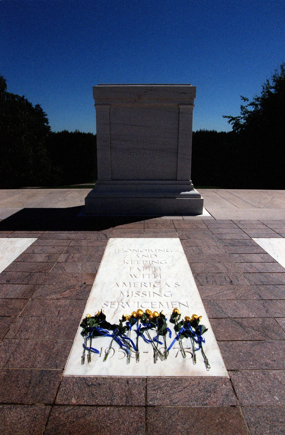 Yellow roses are placed at the base of the empty Vietnam Unknown Crypt.