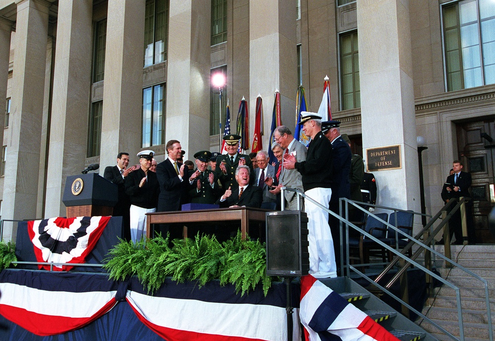 President Bill Clinton gives a thumbs up after signing the National Defense Authorization Act, FY 2000.