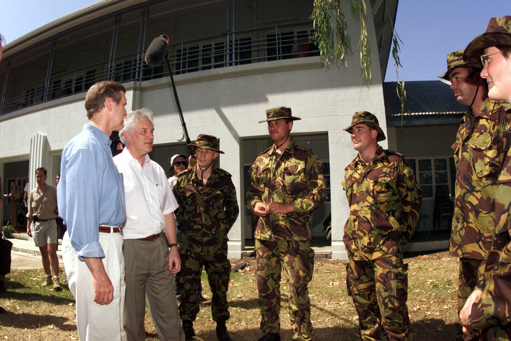Secretary Cohen and Minister of Defense Maxwell Bradford meet with members of the New Zealand Armed Forces.
